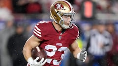 SANTA CLARA, CALIFORNIA - JANUARY 20: Christian McCaffrey #23 of the San Francisco 49ers carries the ball during the first quarter against the Green Bay Packers in the NFC Divisional Playoffs at Levi's Stadium on January 20, 2024 in Santa Clara, California.   Thearon W. Henderson/Getty Images/AFP (Photo by Thearon W. Henderson / GETTY IMAGES NORTH AMERICA / Getty Images via AFP)