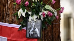 This photograph shows a picture of late Swiss teenage cyclist Muriel Furrer at a makeshift altar in Zurich, on September 29, 2024, on the sidelines of the men's Elite Road Race cycling event during the UCI 2024 Road World Championships. Swiss teenage cyclist Muriel Furrer died on September 27, 2024 a day after suffering a serious head injury in a crash at the world championships. (Photo by Fabrice COFFRINI / AFP)
