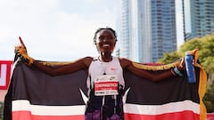 CHICAGO, ILLINOIS - OCTOBER 13: Ruth Chepngetich of Kenya celebrates after crossing the finish line to win the 2024 Chicago Marathon professional women's division and set a new world record with a time of 2:09:56 at Grant Park on October 13, 2024 in Chicago, Illinois.   Michael Reaves/Getty Images/AFP (Photo by Michael Reaves / GETTY IMAGES NORTH AMERICA / Getty Images via AFP)